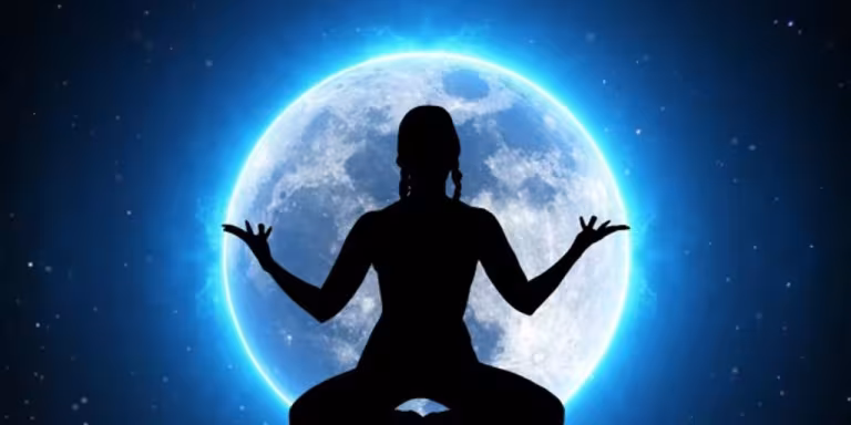 person meditating in a peaceful forest