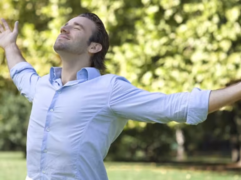 person breathing fresh air in a forest
