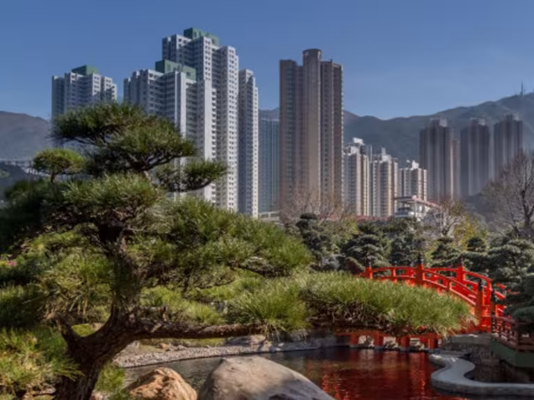 urban park with lush green trees and people walking, emphasizing health and relaxation